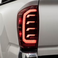 the tail lights of a white pickup truck