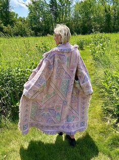 Introducing my latest creation! Upcycled two of the same gorgeous vintage blankets into this dreamy, one of a kind blanket coat! Features double front pockets and toggle closure for added functionality. Perfect statement piece for breezy seaside mornings, late nights at festivals, movie dates, or lounging around the house! Sure to turn heads wherever you may wander! Measurements: Overall length: 55" Pit to pit laying flat: 23" Shoulder seam to wrist: 22" 100% cotton. Machine wash, tumble dry on low heat. This statement jacket was made with all of my heart, for any human, anywhere, that may be attracted to its vibe! My intention is that the piece will amplify the divine nature of your inner being. ✨🌙 Vintage Fall Beach Outerwear, Pink Bohemian Outerwear With Pockets, Pink Bohemian Outerwear For Beach, Bohemian Pink Outerwear For Beach, Pink Bohemian Outerwear For The Beach, Bohemian Pink Outerwear With Pockets, Bohemian Pink Outerwear For The Beach, Oversized Pink Bohemian Outerwear, Oversized Bohemian Pink Outerwear