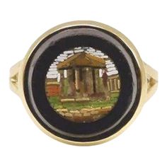 a ring with an image of a temple on it