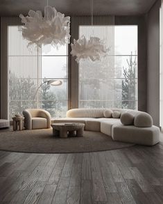 a modern living room with wood floors and large windows