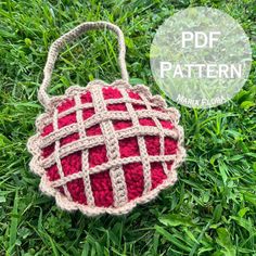 a crocheted basket sitting on top of grass with the text, free pattern