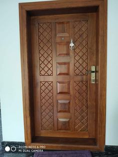 a wooden door with decorative carvings on it