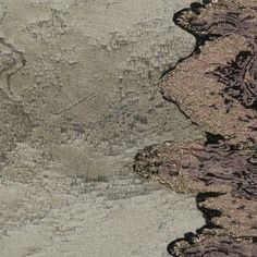 an aerial view of some rocks and water