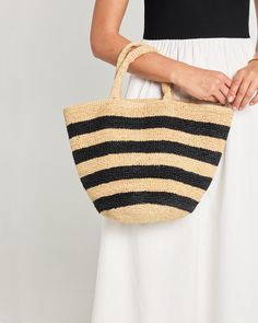 Product Details Introducing the Catania Handmade Raffia Bag - a perfect blend of natural yet chic style. With its black striped design and easy tote design, this handbag is both sophisticated and effortless. - Content: 100% Hand woven Madagascar raffia Style# DAN24KUANTIAO Please note this item is FINAL SALE. We will replace broken items when possible or offer a replacement for items damaged during shipping. Returns, refunds, or replacement products for reasons other than damage incurred during Raffia Basket, Tote Design, Crochet Beach Bags, Summer Fashion Accessories, Summer Tote Bags, Crochet Handbags Patterns, Net Bag, Raffia Bag, Crochet Cross