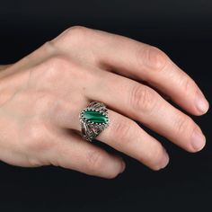 Malachite 925 Silver Cocktail Ring Artisan Made Handcrafted Filigree Art Angel Statement Ring Ring Face Length is 0.65 inches and Width is 0.30 inches Natural Malachite Gemstone is 7X14 mm oval cabochon cut. This metal embroidery filigree ring is oxidized and highly polished. Comes with velvet pouch and luxurious gift box. Filigree is made of delicate metal strands that have been skillfully fashioned to create an outstanding combination of old and modern art. Originating in Mesopotamia, Anatolia Green Sterling Silver Jewelry With Intricate Design, Green Intricate Sterling Silver Jewelry, Green Intricate Design Jewelry Ring, Green Intricate Design Ring, Silver Malachite Gemstone Ring, Vintage Malachite Jewelry For Gifts, Silver Malachite Rings As Gift, Handmade Silver Malachite Rings, Silver Round Malachite Jewelry