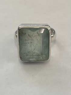 Sterling silver ring with large rectangular aquamarine. The top measures 16 x 18.5 mm ( 5/8 inches x 3/4 inches). The ring shank is about 4.5 mm wide. The ring is stamped: MD T   925 ( please note, half the stamps are worn away) Rectangular Silver Blue Topaz Ring, Modern Rectangular Emerald Ring, Rectangular Silver Emerald Ring For Formal Occasions, Rectangular Aquamarine Ring For Gift, Formal Rectangular Aquamarine Rings, Rectangular Aquamarine Silver Ring, Modern Blue Topaz Rectangular Rings, Modern Rectangular Blue Topaz Ring, Rectangular Silver Topaz Ring For Anniversary