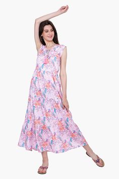 The Roseate Spiral Bird Maxi Dress is the perfect blend of comfort and style. The dress features a V-neck, elasticated waist, and ruffles detail around the neck and at the hem. It is made from a luxurious silk blend and features a beautiful pink geo floral pattern. The tie-up detail at the neck adds a touch of sophistication to the dress and makes it a stunning choice for any occasion. Enjoy the comfort and style of this beautiful maxi dress from your vacations to a sunny brunch in town. Style w Leopard Bag, Beautiful Maxi Dresses, Neck Ruffle, Mini Tote, Bag Dress, Hand Beading, Skirt Pants, Playsuit Jumpsuit, Dress Accessories