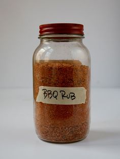 a jar filled with brown stuff sitting on top of a table