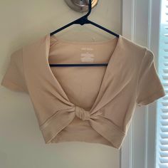 Wild Fable Cropped Beige Top With Knot In The Front. Tighter Fit But Stretch Material. Never Worn! Xs Fitted V-neck Crop Top For Workout, Fitted Beige V-neck Crop Top, Fitted V-neck Workout Crop Top, Fitted Beige Workout Top, Knot Top, Beige Top, Wild Fable, Top Knot, Modest Outfits