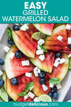 watermelon salad with feta cheese, blueberries and mint on a platter