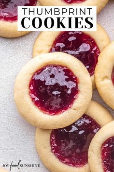 some cookies with jam on them and the words, how to make thumbprint cookies