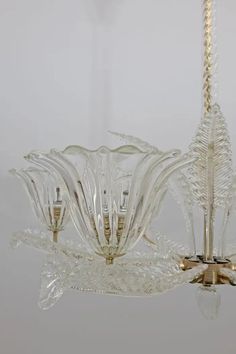 a glass chandelier hanging from a ceiling