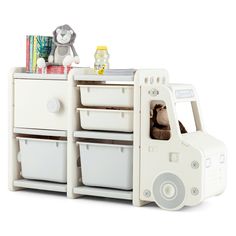 a white toy truck with drawers and stuffed animals