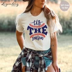 🖤 Welcome to Legendary Apparel Shop 🖤 We make cool tee shirts, tank tops, hoodies, sweatshirts and mugs for people just like you! This Tis The Season Baseball style is available in a unisex tee shirt, racerback tank and crop tee, crop hoodie and pullover hoodie. Perfect for baseball season, cheering in the bleachers or anyone that loves comfy tee shirts! Our products are made to order and ship in 1-2 business days! We design and decorate all of our products here at our shop Florida's Space Coa Baseball Season Fan Apparel Tops With Sublimation Print, Cotton Baseball Shirt With Text Print, Funny Letter Print Tops For Fans, Baseball Season Fan Merchandise Graphic Tee Shirt, Baseball Season Fan Merchandise Graphic Tee, Graphic Tee Shirt For Baseball Season Fan Merchandise, White Ring-spun Cotton Shirt With Letter Print, Pre-shrunk Graphic Tee For Fan Gear, Cotton Tops For Baseball Season Fan Merchandise