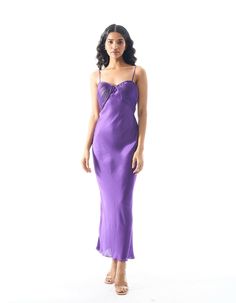 Modal satin slip dress with ruched top detailWear her out a few nights and you’ll soon realise that the Bella Donna Dress is a beauty you can count on. The satin slip dress features an alluring ruched neckline, and comes in an enlivening, vivid, violet hue. Tailored to a slim-fit silhouette with a side-zipper closure to keep you snug.Product details: Material/Fabric - Modal Satin Fit- Slim fit Closure - Side zipper Size chart: SIZE 6 8 10 12 14 16 18 20 (XXS) (XS) (S) (M) (L) (XL) (XXL) (XXXL) B Elegant Wedding Slip Dress With Ruched Detail, Elegant Ruched Slip Dress For Wedding, Sleeveless Satin Dress With Ruched Bodice For Date Night, Ruched Slip Dress With Sweetheart Neckline For Date Night, Elegant Silk Slip Dress With Ruched Back, Satin Midi Dress With Fitted Bodice For Date Night, Sleeveless Ruched Slip Dress For Wedding, Evening Midi Slip Dress With Ruched Bodice, Midi Slip Dress With Ruched Bodice For Date Night