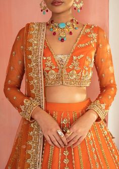 Orange Net Blouse Designs, Orange Lehnga Design, Orange Colour Bridal Lehenga, Orange Colour Lehenga, Orange Colour Blouse Designs, Orange Colour Dress Design, Orange Lehenga Colour Combinations, Orange Chikankari Lehenga, Orange Lengha