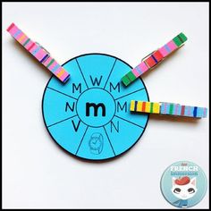 a blue wheel of fortune with rainbows on it and the word mmwm