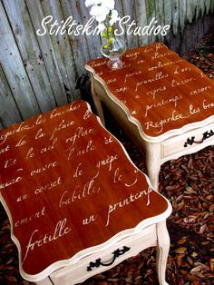 two wooden tables with writing on them