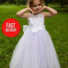 PERFECT FLOWER GIRL DRESS✨ Make order today and SAVE 15%🎁delivery 3-4 days only! Beautiful Baby Flower girl dress with 3D lace embroidery and lilac puffy skirt! Process time: 1-2 working days Delivery time: 2-4 working days  Also offer express overnight delivery https://www.etsy.com/listing/1298332912/express-delivery?click_key=eb8207bd8376c2fa762384c4d5701f79c6bcbc77%3A1298332912&click_sum=63123b47&ga_search_query=express&ref=shop_items_search_1&frs=1 *Train is detachable & all dresses have bo White Tulle Ball Gown For Dress-up, White Princess Dress With Floral Applique For First Communion, White Sleeveless Princess Dress With Fitted Bodice, Princess Style First Communion Dress For Spring, White Princess Dress With Tulle Skirt For Bridesmaid, White Princess Dress With Floral Applique In Tulle, White Tulle Princess Dress With Floral Applique, Princess Style Bridesmaid Dress With Floral Applique, Elegant White Tutu Dress With Floral Applique