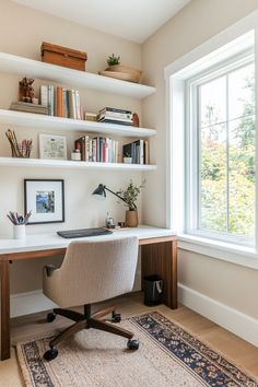 a home office with bookshelves, desk and chair in front of a large window