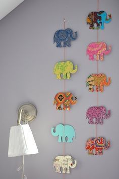 an elephant themed wall hanging in a child's room