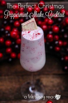 the perfect christmas peppermint shake cocktail is served in a tall glass with a candy bar sticking out of it