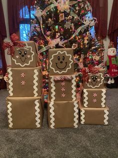 some brown boxes are sitting in front of a christmas tree