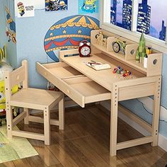 a child's wooden desk and chair in a room