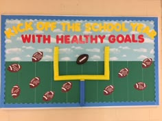 a bulletin board that says kick off the school year with healthy goals and footballs on it