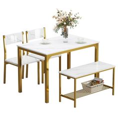 a dining table with white marble top and gold metal frame legs, set of four