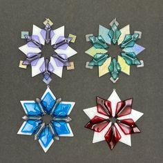 four snowflakes with different colors and designs on them