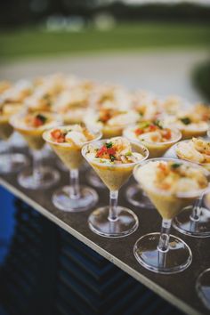 small desserts are lined up on a table