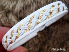 "14K Gold filled wire braided with leather cords, and carefully hand stitched on reindeer leather or lambskin. Completed with a naturally shed hand carved reindeer antler closure. Width: approx. 1,2 cm (0,47\"). Ships in a nice handmade gift box. Design: DRAUPNIR Gold - Magic gold ring, with ability to multiply itself, owned by the Norse God Odin. LEATHER COLORS AND STYLES: Please see last photo - 30 colors to choose from. SIZE: Please measure your wrist and add 1 cm (0,4\"), for a perfect snug Raindeer Crafts, Sami Bracelet, Antler Buttons, Wire Jewellery, Viking Bracelet, Macrame Ideas, Gold Bracelet Cuff, Bracelet Cuff, Viking Jewelry