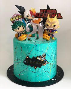 a birthday cake with figurines on top of it