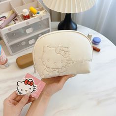 Cartoon Mini Hand-held Cosmetic Bag This adorable Cartoon Mini Hand-held Cosmetic Bag is perfect for storing your beauty essentials on the go! Its compact size makes it easy to carry, while the cute cartoon design adds a touch of charm. Keep your makeup organized and always at hand with this lovely bag. White Kawaii Portable Cosmetic Bag, Compact Portable Pencil Case For Daily Use, Cute Portable White Pouch, Cute Portable Cosmetic Bag For Daily Use, Cute Portable Cosmetic Bag For Gift, Cute Cosmetic And Toiletry Pouch For Daily Use, Cute Portable Cosmetic Bag Gift, Kawaii Portable Pouch For Daily Use, Cute Portable Pouch For Daily Use