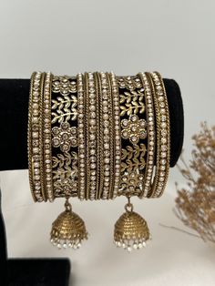 Metal stone  bangles set .  includes- 2  middle kade with jhumki 4 side   bangles . Heavy Metal Bangle For Festivals, Festive Metal Bangle For Festivals, Punjabi Bangles, Indian Bracelets, Bracelet Indian, Metal Bangles, Stone Bangles, Indian Bangles, Bangles Set