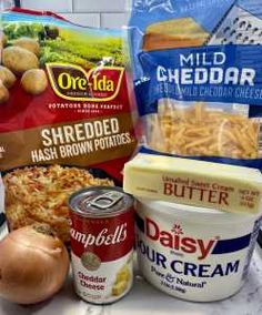 some food items are sitting on a counter top next to other foods and condiments