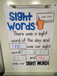 there is a sign that says sight words on the wall in front of a refrigerator