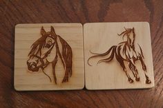 two wooden coasters with horses on them