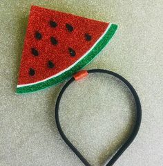 a headband with a watermelon design on it