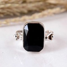 Natural Black Obsidian Ring Faceted Obsidian Gemstone Ring Women Obsidian Ring Natural Crystal Healing Jewelry Obsidian Ring  Dimension :- JEWELRY CATEGORY:- HANDMADE RING STONE NAME:-  Obsidian STONE SHAPE:- -Rectangle Cushion STONE TYPE:- Natural  PLATING:- METAL: - STERLING SILVER RING SIZE:- ALL SIZES AVAILABLE PURTY:- 925  Shipping:- All the parcels will be shipped with in 1-2 days of purchase... Payment:- We accept payment through PAYPAL only.... I make every effort to picture each item as Black Faceted Rings For Gift, Rectangular Onyx Gemstone Rings, Black Faceted Rings For Formal Occasions, Black Spinel Gemstone Rings For Gift, Black Spinel Gemstone Rings As A Gift, Elegant Obsidian Gemstone Jewelry, Elegant Onyx Crystal Ring With Gemstone Details, Elegant Onyx Crystal Ring With Gemstone, Elegant Onyx Crystal Ring