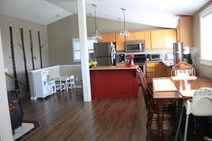 a kitchen and dining room with wood floors