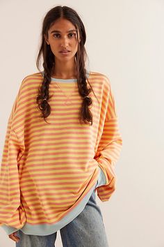 So cool and classic, this timeless crewneck is featured in an oversized, slouchy silhouette and staple striped print with contrasting hems for added dimension. **Fit:** Relaxed, oversized fit **Features:** Crew neckline, dropped shoulders, contrast hems **Why We | Classic Striped Oversized Crewneck by We The Free at Free People in Orange, Size: L Loungewear Fashion, Trendy Sweaters, Oversized Crewneck, Striped Sweatshirts, Free People Clothing, Orange Shirt, Free People Sweater, Cool Sweaters, Cute Tshirts