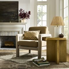 a living room filled with furniture and a fire place next to a painting on the wall