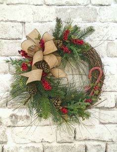 a christmas wreath on a brick wall