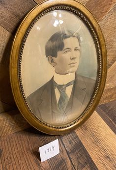 an old photo of a man in a suit and tie with a price tag on it