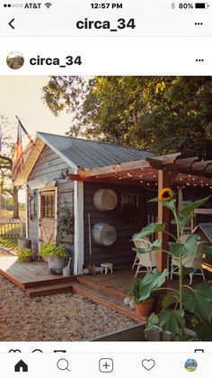 an instagram photo of a small house with sunflowers