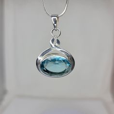 Blue Topaz is the birthstone for the month of December, and the stone given in celebration of the 4th and 19th anniversaries of marriage. Topaz is a symbol of love and affection, and has been said to be an aid to ones sweetness and disposition. The blue topaz necklace is handmade jewelry set in sterling silver. Please check out our store as a whole for the finest in quality and care. Topaz Birthstone Gemstones For Gifts, Silver Birthstone Necklace With Oval Pendant, Silver Oval Pendant Birthstone Necklace, Sterling Silver Birthstone Oval Pendant Jewelry, Blue Topaz Birthstone Necklace For Anniversary, Hallmarked Round Pendant Gemstones For Gifts, Round Pendant Hallmarked Gemstones As Gift, Oval Sterling Silver Birthstone Gemstones, Anniversary Blue Topaz Birthstone Necklace