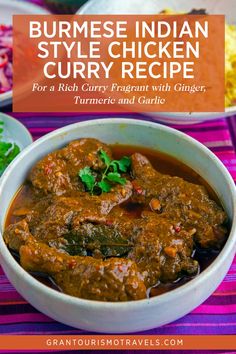 a bowl filled with curry and garnish on top of a purple table cloth