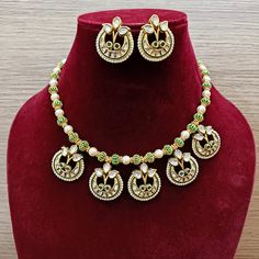 Description: Elevate your look with our Designer Gold Plated Kundan & Ruby Stone Necklace with Earrings. The intricate design and high-quality materials add a touch of elegance to any outfit. Perfect for special occasions or everyday wear, this set is a must-have for any fashion-forward individual. About: Eye-catching and unique jewelry that will set you apart. Gift this piece to a loved one, and see their face light up with joy. Best for gifting or for personal use, wear it to any occasion and Elegant Meenakari Metal Jewelry Sets, Festive Round Kundan Necklace In Metal, Festive Round Kundan Metal Necklace, Festive Metal Kundan Necklace, Festive Meenakari Metal Jewelry Sets, Festive Round Metal Jewelry Sets, Temple Jewelry Sets With Matching Earrings, Diwali Party Jewelry Sets, Traditional Round Jewelry Sets For Party